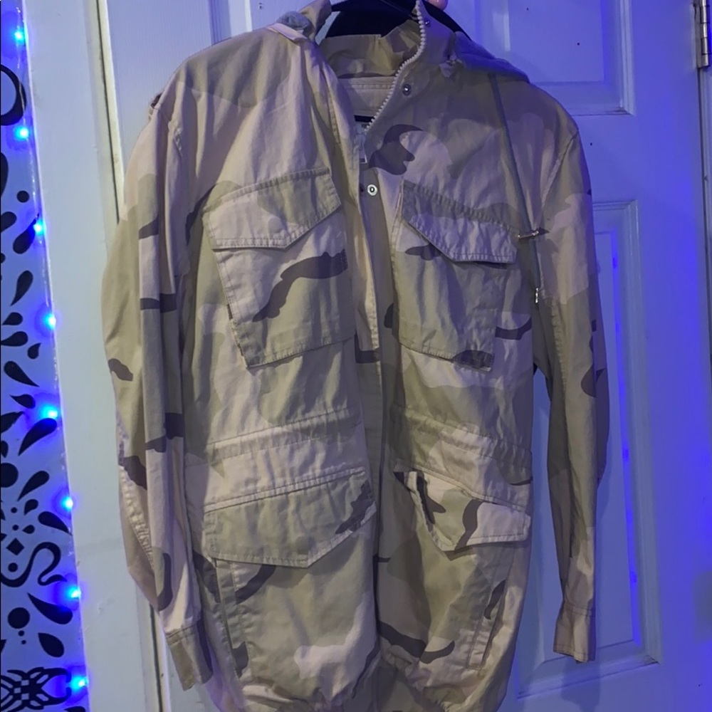 Cream color camo jacket with a grey hoodie